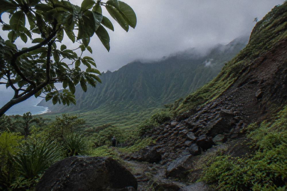 Low clouds drifting over green mountain ridges above a Kauai valley