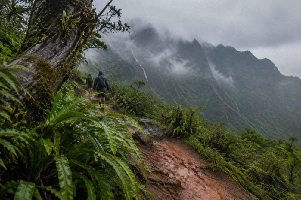 Heavy rain clouds over green ridges on the windward side of Kauai