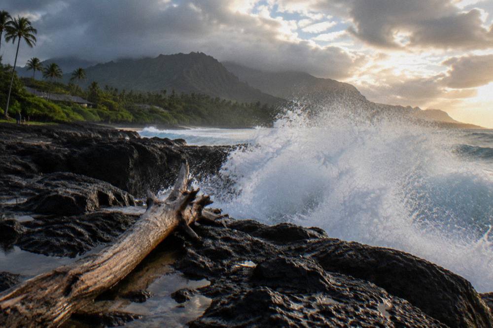 Large winter waves breaking along a rocky north shore coastline